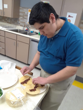 Student making tacos.