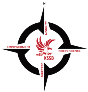 A black compass rose with a red KSSB eagle in the middle.