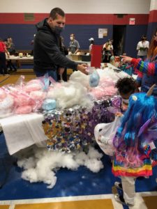 table decorate with sequins and cotton candy on top that looks like clouds