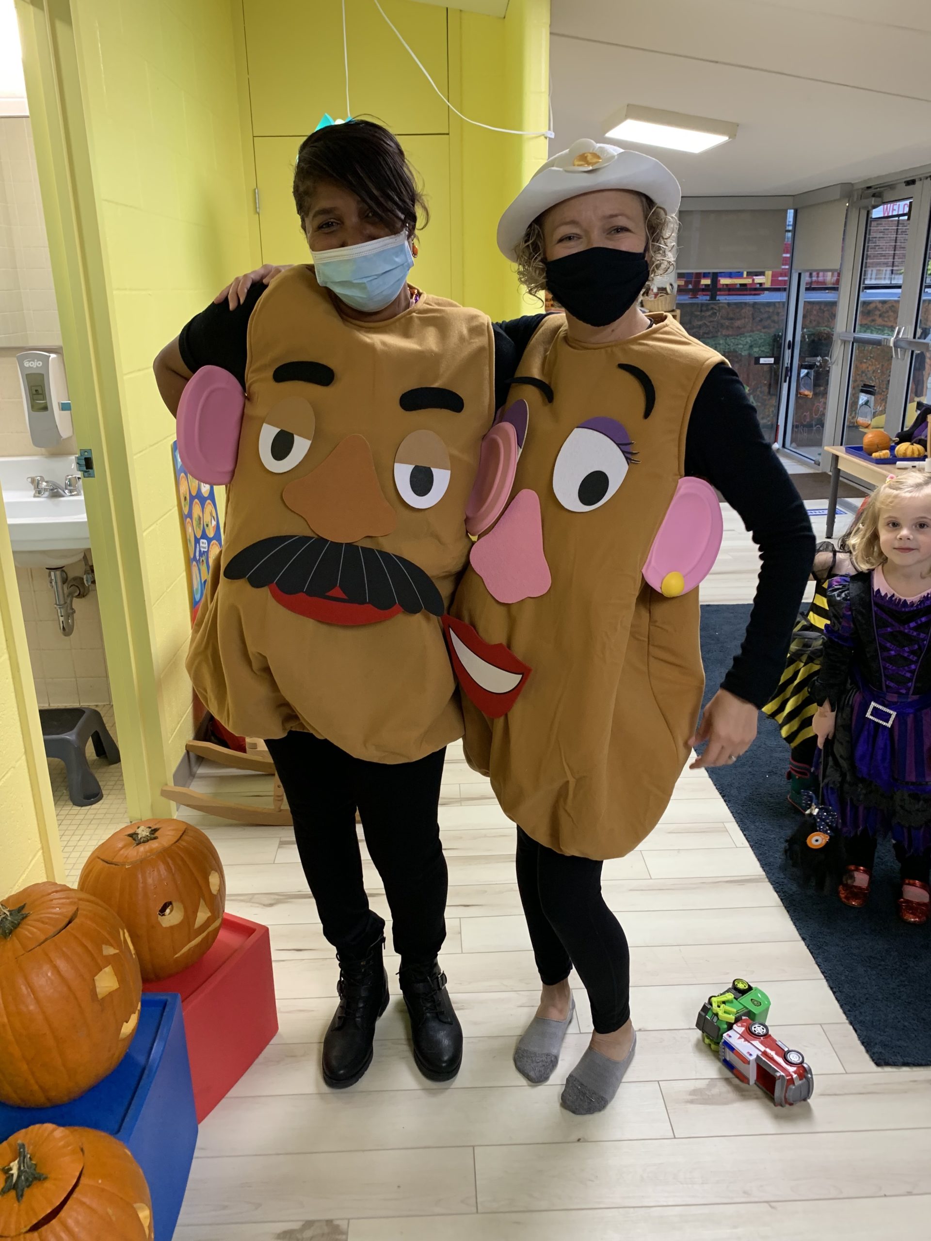 Miss Angela and Miss Jeanne dressed up as Mr. Potato Head for Halloween