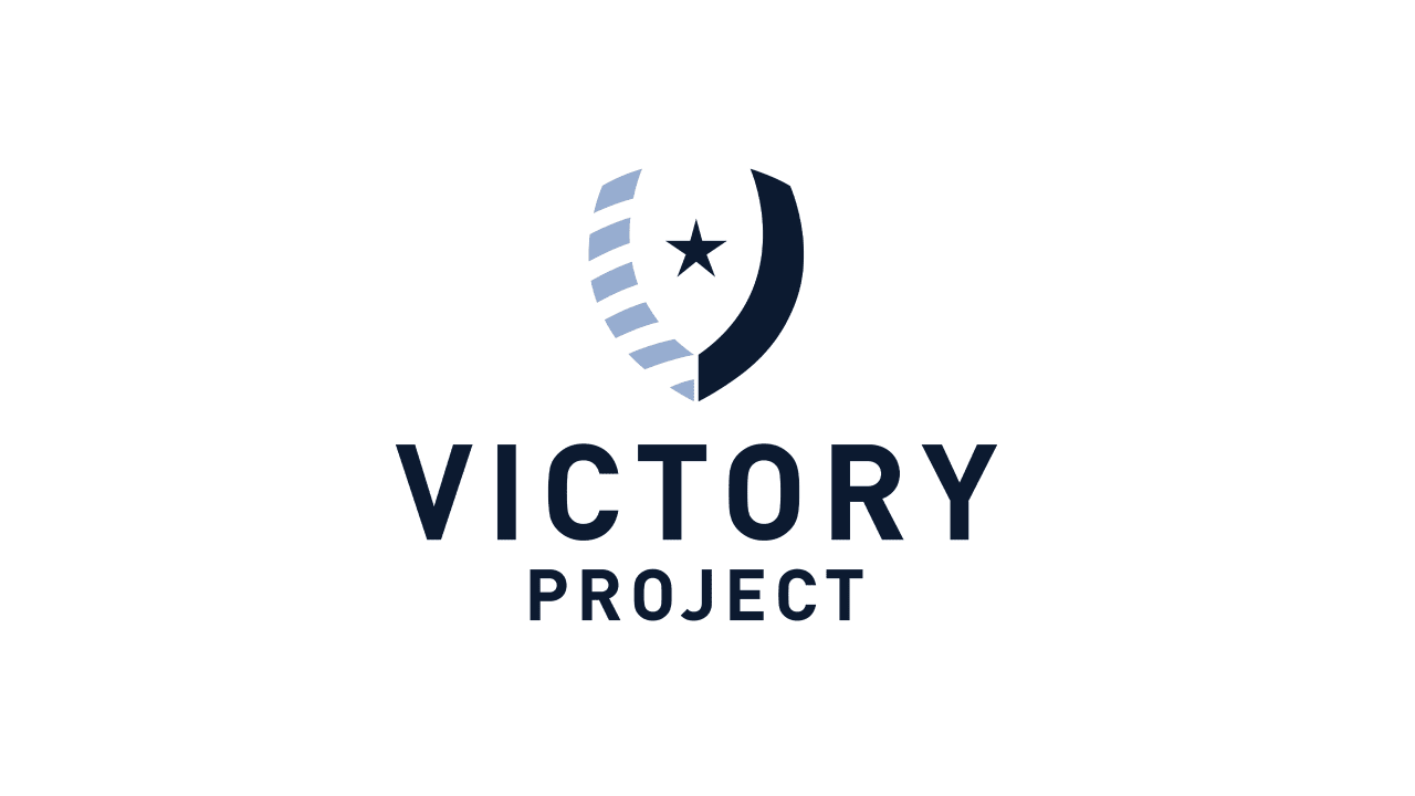 A logo has a shield in the shape of a "V" with light and dark blue elements with words that display the Victory Project underneath